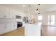 Beautiful kitchen with stainless appliances, modern cabinets and an island with a stylish faucet at 2438 Sw 165Th Street Rd, Ocala, FL 34473