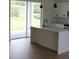 Open kitchen layout featuring sleek counters, island with sink and stainless steel appliances at 2438 Sw 165Th Street Rd, Ocala, FL 34473