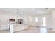 A modern kitchen with white cabinets, stainless steel appliances, and a center island at 2438 Sw 165Th Street Rd, Ocala, FL 34473