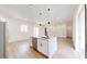 Bright kitchen features stainless appliances, stylish island with hanging pendant lights, and plenty of cabinet space at 2438 Sw 165Th Street Rd, Ocala, FL 34473