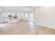 A spacious floorplan combines the living room and kitchen with white cabinetry and recess lights at 2438 Sw 165Th Street Rd, Ocala, FL 34473