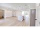 Open-concept living space with a large island, stainless steel appliances, and wood flooring at 2438 Sw 165Th Street Rd, Ocala, FL 34473