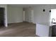 Open living room with ample space featuring an island, new flooring, and natural light at 2438 Sw 165Th Street Rd, Ocala, FL 34473