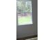 Window view shows green backyard in a bright room at 2438 Sw 165Th Street Rd, Ocala, FL 34473