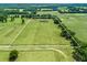 Expansive acreage features a well-maintained home, with lush green fields and mature trees within the property lines at 2540 Ne 120Th St, Anthony, FL 32617