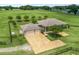 Aerial view of a single Gathering home with a large lawn, mature trees and a two car garage at 2540 Ne 120Th St, Anthony, FL 32617