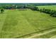 Expansive aerial view of a sprawling green property with pastures and mature trees at 2540 Ne 120Th St, Anthony, FL 32617