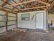 Barn featuring interior workshop space, electrical box, and convenient door access at 2540 Ne 120Th St, Anthony, FL 32617