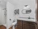 Functional bathroom features a sink, toilet, shower, vanity, and fixtures at 2540 Ne 120Th St, Anthony, FL 32617