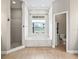Bright bathroom with tile floor, garden tub, and walk-in shower at 2540 Ne 120Th St, Anthony, FL 32617