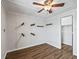 Bedroom features wood-look floors, a ceiling fan, and access to a closet at 2540 Ne 120Th St, Anthony, FL 32617