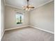 Empty bedroom with gray carpet and window at 2540 Ne 120Th St, Anthony, FL 32617