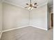Bedroom with gray carpet and ceiling fan at 2540 Ne 120Th St, Anthony, FL 32617