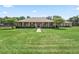Well-maintained home with a lush green lawn and mature landscaping, offering a welcoming and picturesque curb appeal at 2540 Ne 120Th St, Anthony, FL 32617