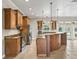 Modern kitchen complete with wood cabinets, granite countertops, stainless steel appliances, and a center island at 2540 Ne 120Th St, Anthony, FL 32617