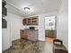 Small kitchenette features a sink, microwave, shelving, and cabinets at 2540 Ne 120Th St, Anthony, FL 32617