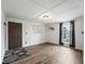 Cozy living room boasts wood-look floors, a window with curtains, and a decorative rug at 2540 Ne 120Th St, Anthony, FL 32617