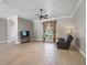 Cozy living room with tile floors and comfortable seating area near the window at 2540 Ne 120Th St, Anthony, FL 32617