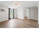 Bright living room features wood-look floors, a window with curtains, and white walls at 2540 Ne 120Th St, Anthony, FL 32617