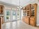 Living area with built-in storage and double glass doors, showing an open and spacious interior at 2540 Ne 120Th St, Anthony, FL 32617