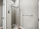 Modern tiled shower with a glass door and a chrome towel bar, offering a spa-like experience at 2540 Ne 120Th St, Anthony, FL 32617