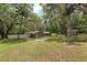 Expansive backyard featuring mature trees and lush greenery, ideal for outdoor activities and relaxation at 4010 Sw 7Th Avenue Rd, Ocala, FL 34471