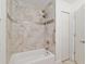 Clean bathroom featuring tile and shower/tub combo at 4010 Sw 7Th Avenue Rd, Ocala, FL 34471