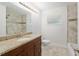 Well-lit bathroom showcasing granite counters, stylish vanity, and tiled shower/tub combo at 4010 Sw 7Th Avenue Rd, Ocala, FL 34471