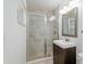 Updated bathroom featuring a glass-enclosed shower, modern vanity, and neutral tiling at 4010 Sw 7Th Avenue Rd, Ocala, FL 34471