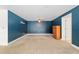 Spacious bedroom features plush carpet, a ceiling fan and a calming blue accent wall at 4010 Sw 7Th Avenue Rd, Ocala, FL 34471