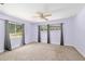 Spacious bedroom with natural light from multiple windows and neutral carpet at 4010 Sw 7Th Avenue Rd, Ocala, FL 34471