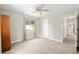 Carpeted bedroom with two windows that let in natural light at 4010 Sw 7Th Avenue Rd, Ocala, FL 34471