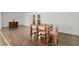 A casual dining room includes a wood table and seating for four, hardwood floors, and natural light at 4010 Sw 7Th Avenue Rd, Ocala, FL 34471