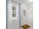 Bright entryway with natural light from a window and white door leading into the home at 4010 Sw 7Th Avenue Rd, Ocala, FL 34471