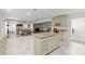 Spacious open-concept kitchen with center island and views of the living room, dining area, and bar at 4010 Sw 7Th Avenue Rd, Ocala, FL 34471