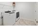 Well-equipped laundry room with modern washer and dryer, plus overhead storage at 4010 Sw 7Th Avenue Rd, Ocala, FL 34471