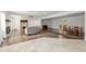 Spacious living room featuring hardwood flooring, fireplace, and open floor plan to the dining area at 4010 Sw 7Th Avenue Rd, Ocala, FL 34471