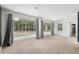 Bright living room features large sliding glass doors with backyard view at 4010 Sw 7Th Avenue Rd, Ocala, FL 34471