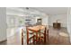 A casual living room opens to the kitchen and dining room with hardwood floors at 4010 Sw 7Th Avenue Rd, Ocala, FL 34471