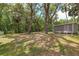 Exterior view of shed surrounded by mature trees and green and brown grass at 4010 Sw 7Th Avenue Rd, Ocala, FL 34471