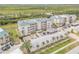 Aerial view of condos with lush landscaping and convenient parking at 420 Bouchelle Dr # 204, New Smyrna Beach, FL 32169