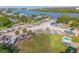 Scenic aerial view of the boatyard with a variety of boats and surrounding waterfront landscape at 420 Bouchelle Dr # 204, New Smyrna Beach, FL 32169