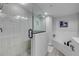 Modern bathroom with walk-in shower featuring stone tiles, plus a soaking tub with white subway tile backsplash at 420 Bouchelle Dr # 204, New Smyrna Beach, FL 32169