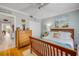 Comfortable bedroom featuring wood bed frame, hardwood floors, and large closet at 420 Bouchelle Dr # 204, New Smyrna Beach, FL 32169