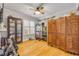 Versatile bonus room with unique wood divider, crown molding, and hardwood floors at 420 Bouchelle Dr # 204, New Smyrna Beach, FL 32169