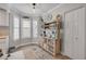 Charming dining area with bright natural light, storage, and a coastal rug at 420 Bouchelle Dr # 204, New Smyrna Beach, FL 32169