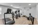 Well-equipped gym space featuring a treadmill, stationary bikes, and rowing machine for convenient at-home workouts at 420 Bouchelle Dr # 204, New Smyrna Beach, FL 32169