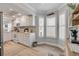 Bright kitchen with white cabinetry, modern appliances, and wood-look tile flooring at 420 Bouchelle Dr # 204, New Smyrna Beach, FL 32169