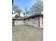 Backyard view showcasing the yard and home elevation at 421 Sw 3Rd St, Ocala, FL 34471