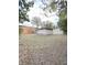 Spacious backyard featuring a storage shed with trees surrounding the perimeter of the property at 421 Sw 3Rd St, Ocala, FL 34471